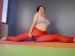 Regina Noir practices yoga in the gym wearing a seductive red yoga leotard