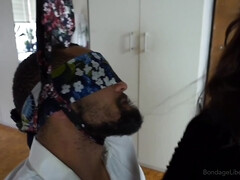 Sub dude is restrained and blindfolded by the kinky brunette