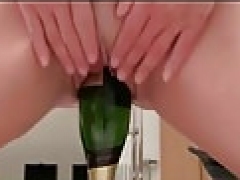 redhead kitten put a champagne bottle in her pussy