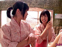 group of tiny Japanese honies sharing trouser snake in onsen