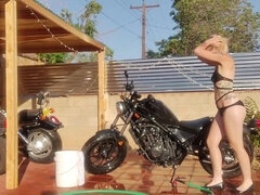 Blonde, carwash, bikini model strip