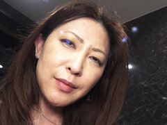 Japanese MILF Miho Nakamori plays with her pussy solo