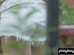 Sophie posed nude among the green plants