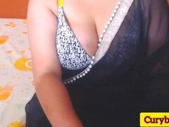 Sultry Indian wife Trisha teases in black saree while working from home, showing off her massive breasts