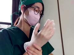 Petite Asian nurse is giving a handjob to her patient