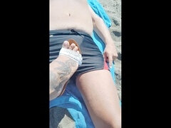Milf flaunts her ass, feet, and sexy fetish boots on the beach in high high-heeled slippers